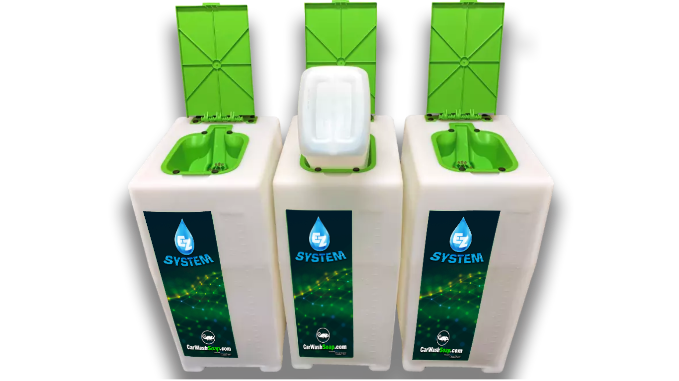 Three EZ System car wash chemical storage tanks with green lids, one with a Twin Pack jug seated in the lid